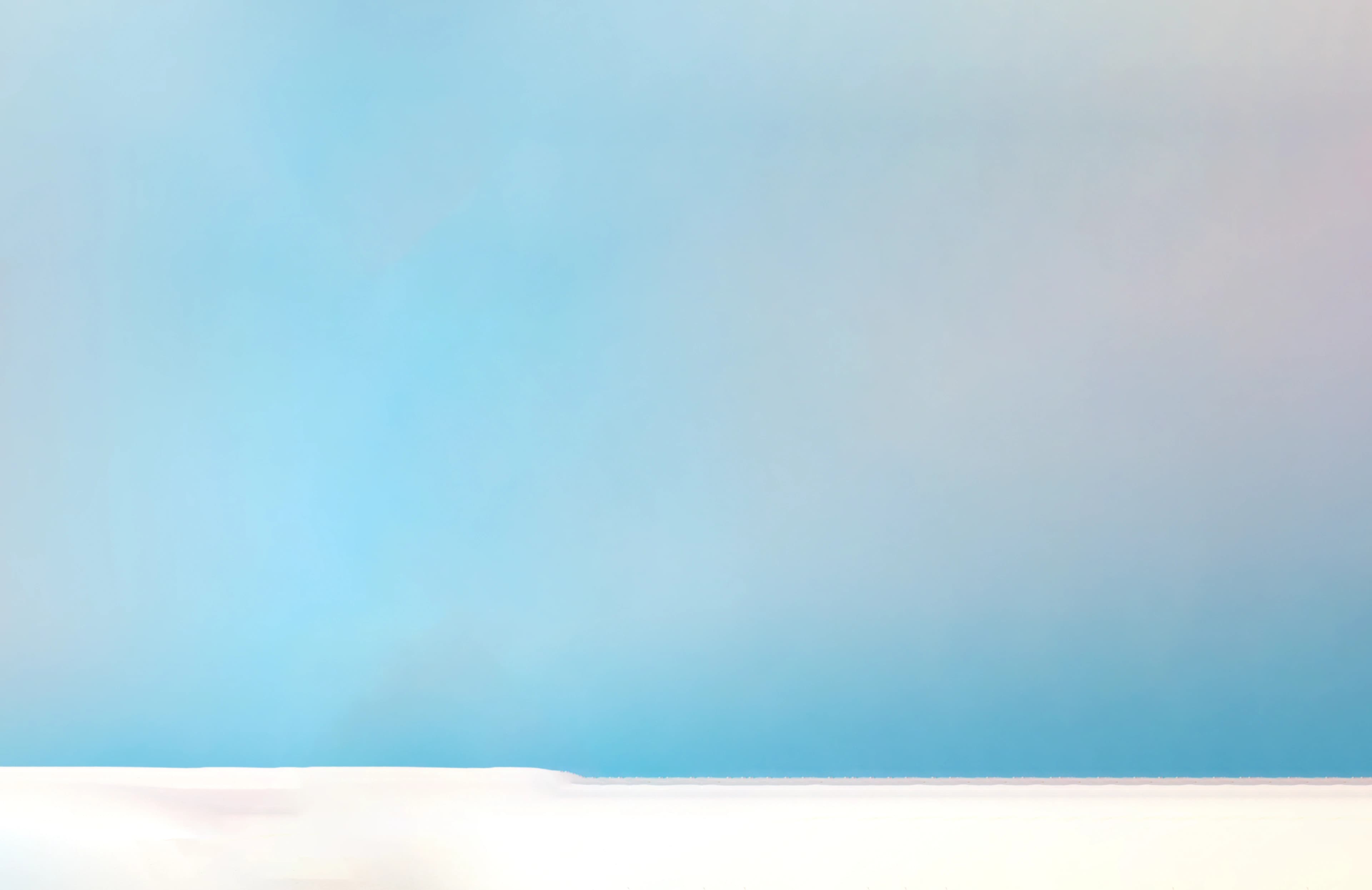 Blue sky gradient with snow at the base